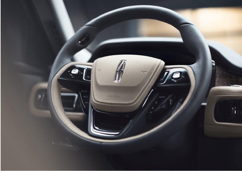 The intuitively placed controls of the steering wheel on a 2023 Lincoln Aviator® SUV | Griffin Lincoln in Tifton GA