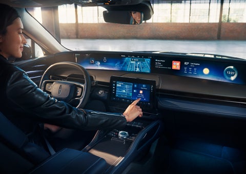 The driver of a 2024 Lincoln Nautilus® SUV interacts with the center touchscreen. | Griffin Lincoln in Tifton GA