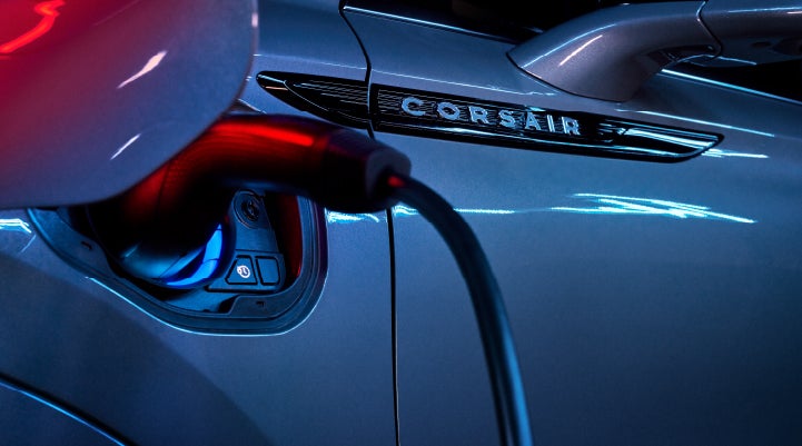 A charger plugged into the charging port of a 2024 Lincoln Corsair® Plug-in Hybrid model. | Griffin Lincoln in Tifton GA