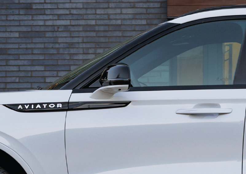 The driver’s door of a white 2025 Lincoln Aviator® SUV is showcased. | Griffin Lincoln in Tifton GA
