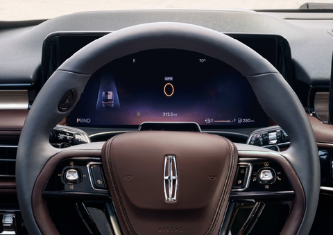 The steering wheel of 2025 Lincoln Aviator® SUV is shown with black and brown accents. | Griffin Lincoln in Tifton GA