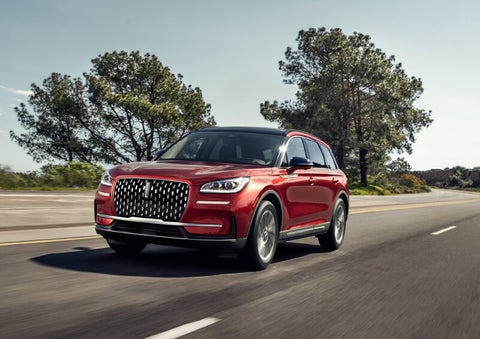 A 2025 Lincoln Corsair® SUV is shown being driven on a country road. | Griffin Lincoln in Tifton GA