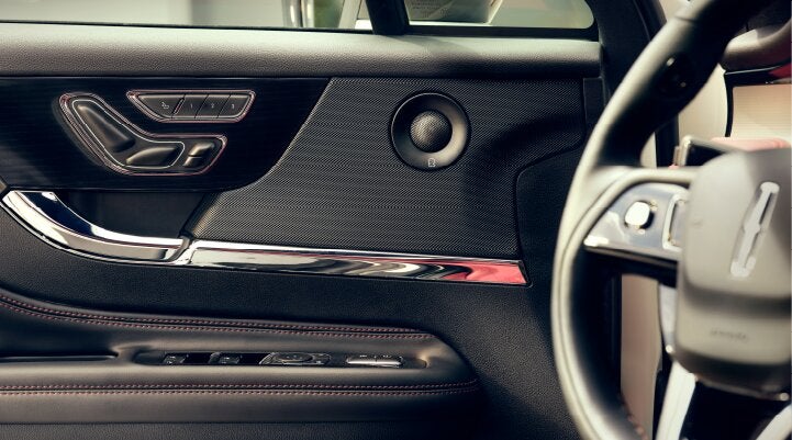 A Revel® audio speaker is shown in the driver's side door of a 2025 Lincoln Corsair® SUV. | Griffin Lincoln in Tifton GA