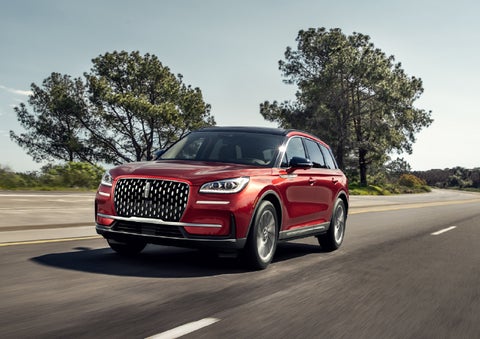 A 2026 Lincoln Corsair® SUV is shown being driven on a country road. | Griffin Lincoln in Tifton GA