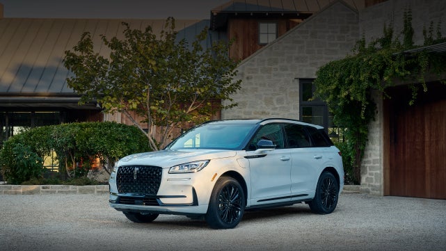 A 2026 Lincoln Corsair® SUV is parked in front off a luxury home. | Griffin Lincoln in Tifton GA