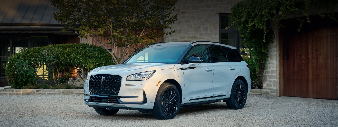 A 2026 Lincoln Corsair® SUV is parked in front off a luxury home. | Griffin Lincoln in Tifton GA