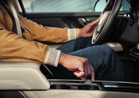 The driver of a 2026 Lincoln Corsair® SUV is shown selecting a drive mode. | Griffin Lincoln in Tifton GA