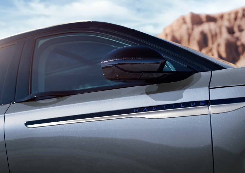 Blue lettering on the side of the vehicle that reads Nautilus indicates the available Hybrid Powertrain. | Griffin Lincoln in Tifton GA