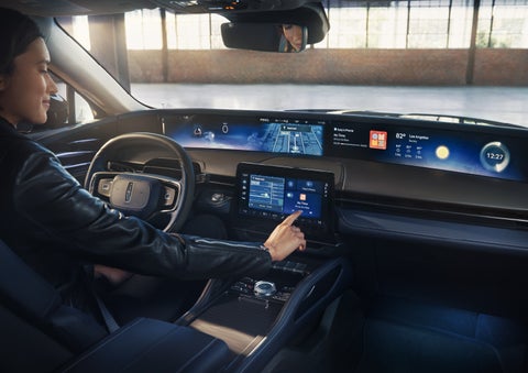 The driver of a 2026 Lincoln Nautilus® SUV interacts with the center touchscreen. | Griffin Lincoln in Tifton GA