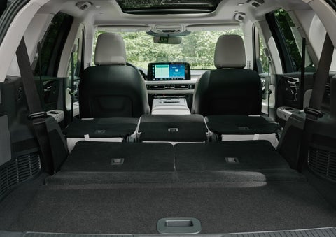 A rear to front view of the interior of a 2027 Lincoln Aviator® Black Label™ SUV shows the third and second rows folded flat | Griffin Lincoln in Tifton GA